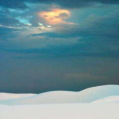 White dunes in foreground with darkened sky